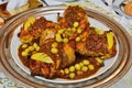 Traditional moroccan tajine with chicken,pototoes and olives close up.