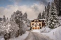 Traditional mountain chalet in snowy landscape