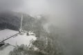 Traditional mountain remote cabins and houses in winter highlands