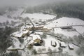 Traditional mountain remote cabins and houses in winter highlands