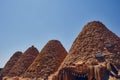 Roofs of beehive houses opposite bright clear sky