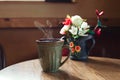 Traditional mug of cofee on wooden cafe table