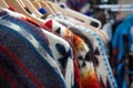 Traditional multi colored woolen knitwear clothes for sale on a market stall Traditional multi colored woolen knitwear clothes for Royalty Free Stock Photo