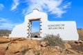 Traditional municipality sign white arch gate near Betancuria village with desert landscape in the background, Fuerteventura, Royalty Free Stock Photo