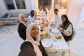A traditional Muslim family captures the joy of their shared iftar meal during the sacred month of Ramadan through a