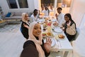 A traditional Muslim family captures the joy of their shared iftar meal during the sacred month of Ramadan through a