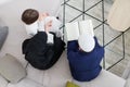 Muslim family reading Quran and praying at home top view