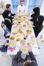 Traditional muslim family praying before iftar dinner Royalty Free Stock Photo