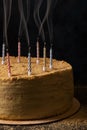 Traditional napoleon cake with smoke over candles