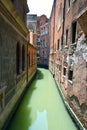 Traditional narrow canal street with old houses in Venice, Italy Royalty Free Stock Photo