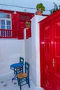 Nice red details of whitewashed villa street of Chora Mykonos Cyclades Greece Royalty Free Stock Photo