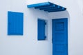 traditional narrow street in Mykonos with blue doors and white walls Royalty Free Stock Photo