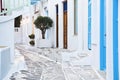 traditional narrow street in Mykonos with blue doors and white walls Royalty Free Stock Photo