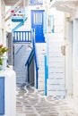 traditional narrow street in Mykonos with blue doors and white walls Royalty Free Stock Photo