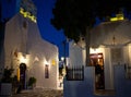 traditional narrow street in Mykonos with blue doors and white walls Royalty Free Stock Photo