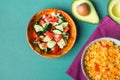 Traditional National Mexican Tomato Rice Stewed Pilaf with Hot Chili Peppers Garlic in Bowl. Fresh Cucumber Onion Salsa Avocado Royalty Free Stock Photo