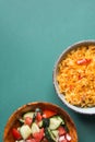 Traditional National Mexican Tomato Rice Stewed Pilaf with Hot Chili Peppers Garlic in Bowl. Fresh Cucumber Onion Salsa Royalty Free Stock Photo