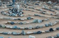 Traditional natural stone labyrinth maze made for contemplation and worship, created with rocks in shades of blue and turquoise