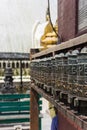 Traditional Nepalese prayer wheel in a vibrant outdoor setting