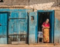 Traditional Nepali Village life. Woman selling water