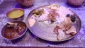 traditional nepali thali served on a brass plate with rice,meat curry, lentils and other side dishes. staple food for nepali