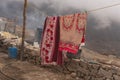 Traditional Nepali Village life. Airing rugs before winter Royalty Free Stock Photo