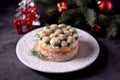 Traditional New Year`s Russian salad `Mushroom Glade` from boiled potatoes, carrots, eggs, smoked meat, soft cheese and marinated Royalty Free Stock Photo