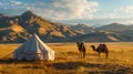 Traditional nomadic yurt and camels in the picturesque landscape of the Mongolian steppe at sunset. Royalty Free Stock Photo