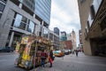 Traditional North American food truck with people ordering food in Downtown Toronto, Ontario, selling burgers, fries and poutine