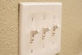 Traditional North American toggle white house electric light switch in ON position
