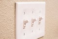 Traditional North American toggle white house electric light switch in ON position