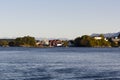 Traditional Norwegian house surrounded by trees and near the sea Royalty Free Stock Photo