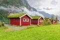 Traditional Norwegian red houses with a turf roof. Old farm hotel near Lake - norway Royalty Free Stock Photo