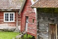 Traditional norwegian wooden red colored cabin houses facades. O