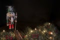 Traditional nutcracker with decorative pine border and a black background Royalty Free Stock Photo