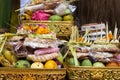 Traditional offerings to gods in Indonesia with flowers, fruits and aromatic sticks in temple, buddhist Royalty Free Stock Photo