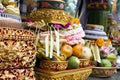 Traditional offerings to gods in Indonesia with flowers, fruits and aromatic sticks in temple, buddhist Royalty Free Stock Photo