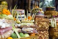 Traditional offerings to gods in Indonesia with flowers, fruits and aromatic sticks in temple, buddhist Royalty Free Stock Photo