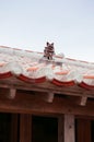 Traditional Okinawa local house tile roof with Shisa sculpture Royalty Free Stock Photo