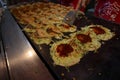 Traditional okonomiyaki pamcakes on the street of Osaka Royalty Free Stock Photo