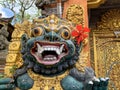 Traditional old ancient Balinese statue of demon angel called barong bali guarding sacred ritual temple Royalty Free Stock Photo