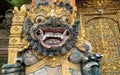 Traditional old ancient Balinese statue of demon angel called barong bali guarding sacred ritual temple