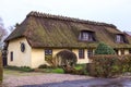 Traditional old country house with thatched straw roof in Denmark Royalty Free Stock Photo