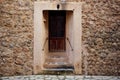 Traditional old door and wall in the historic village Deia in Majorca Royalty Free Stock Photo