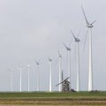 Traditional old dutch windmill goliath and wind turbines near eemshaven in the northern province groningen of the netherlands Royalty Free Stock Photo