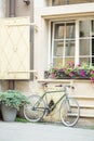 Traditional old european house and road with bicycles, flowers, plants and windows. Urban landscape Royalty Free Stock Photo