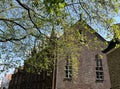 Traditional old-fashioned brick building in Minnewater park area in Brugge, Belgium, on spring sunny day Royalty Free Stock Photo