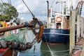 Traditional old german fishing cutter boats moored Neuharlingersiel harbor Wadden sea East Frisia Northern Germany