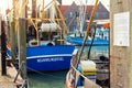 Traditional old german fishing cutter boats moored Neuharlingersiel harbor Wadden sea East Frisia Northern Germany