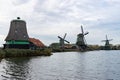 Traditional Old Green Windmills along the Zaan River in Zaanse Schans Netherlands